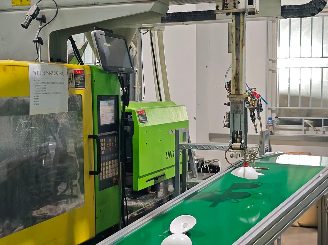 XJHMFG automated injection molding production hall with robotic arms